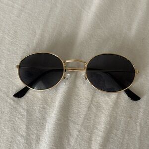 Oval gold rimmed sunglasses